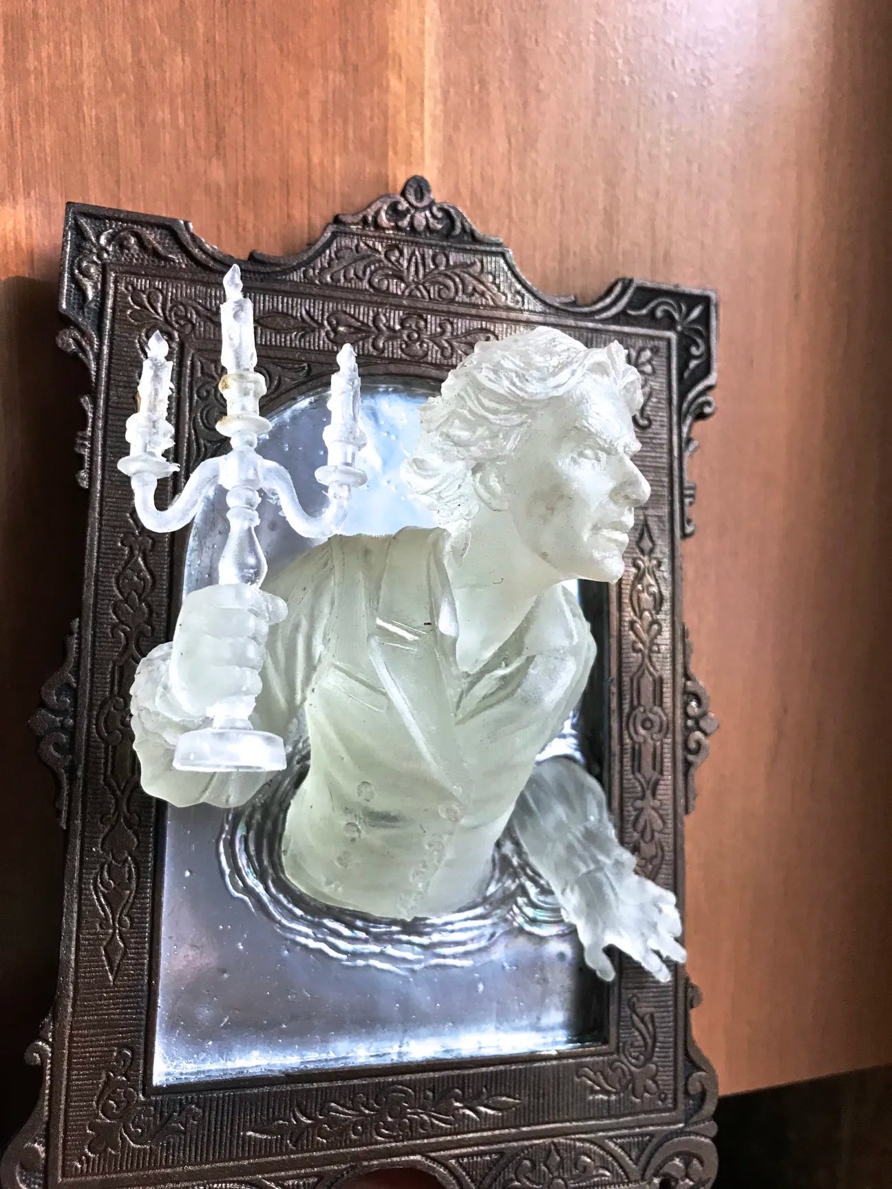 SPOOKY WALL SCULPTURES OFVICTORIAN GHOSTS EMERGINGFROM A MIRROR