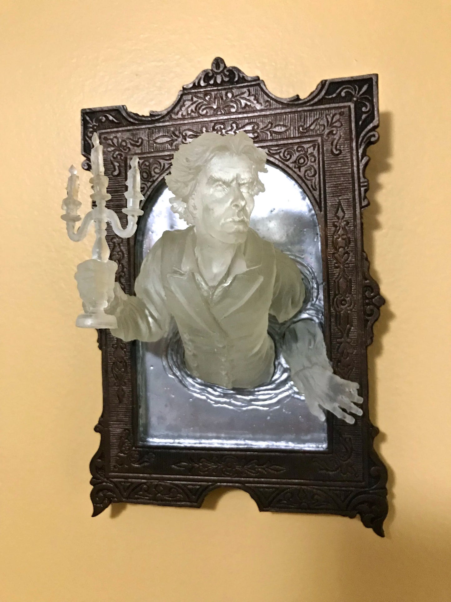 SPOOKY WALL SCULPTURES OFVICTORIAN GHOSTS EMERGINGFROM A MIRROR